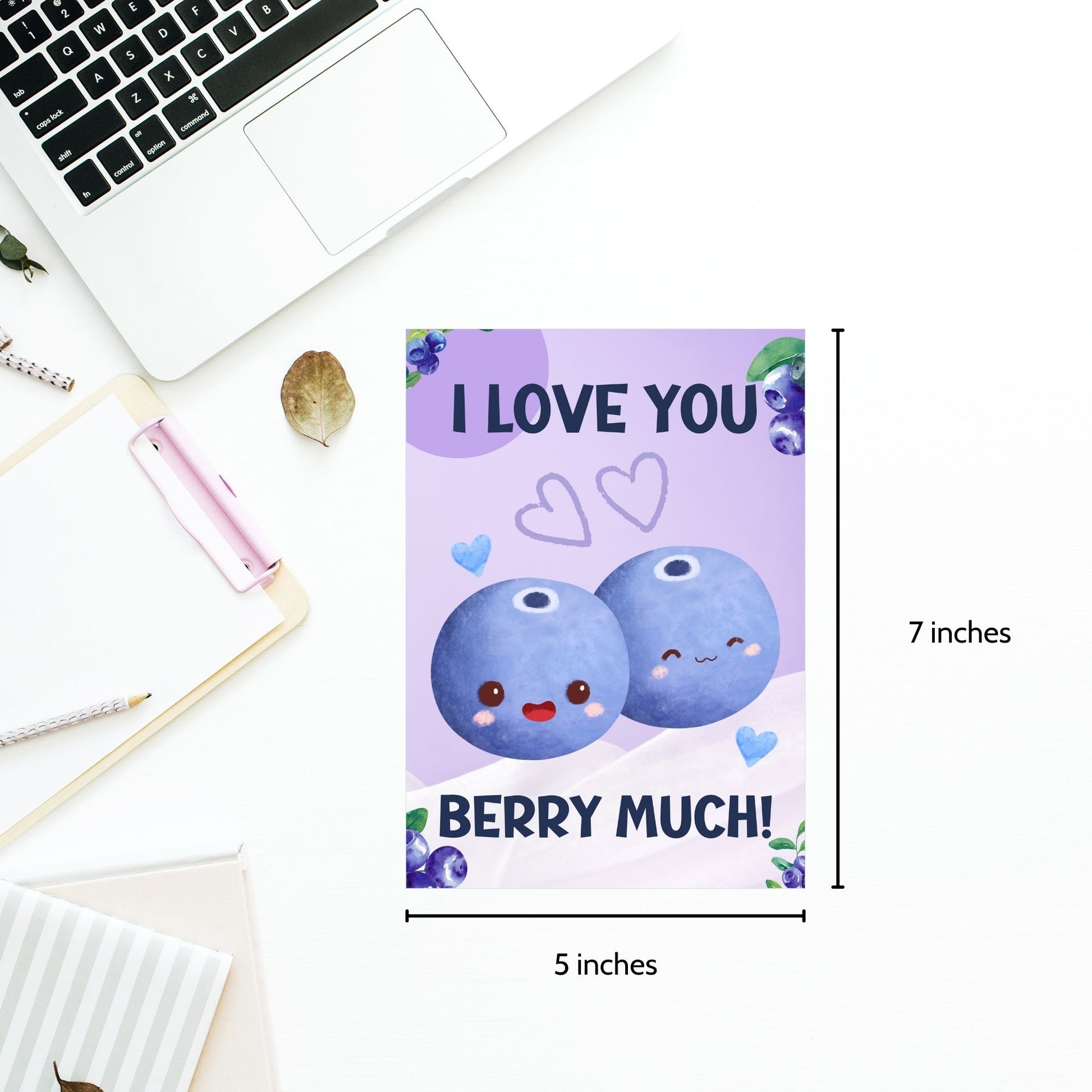 Printable Valentine’s Day Greeting Card featuring the phrase “I Love You Berry Much” with a blueberry theme. Designed as a 5x7 PDF on an 8.5 x 11 sheet with two cards per page. A sweet and punny Valentine’s card for loved ones.