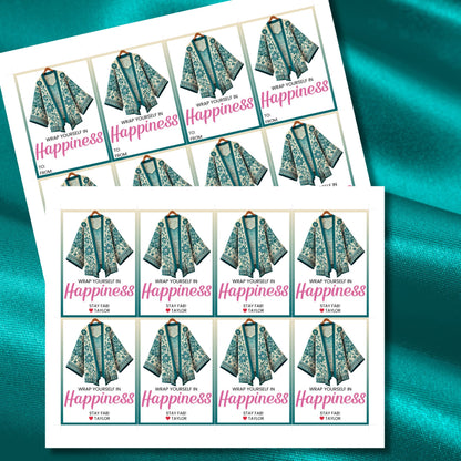 Printable kimono gift tags featuring a colorful kimono design with the text "Wrap Yourself in Happiness" and customizable space for names, perfect for adding a personal touch to any gift.