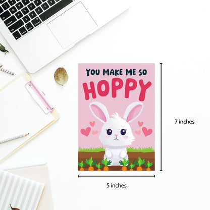 Printable Valentine’s Day Greeting Card featuring the pun “You Make Me So Hoppy.” Designed as a 5x7 PDF on an 8.5 x 11 sheet with two cards per page. A fun and cute Valentine’s card for bunny lovers.