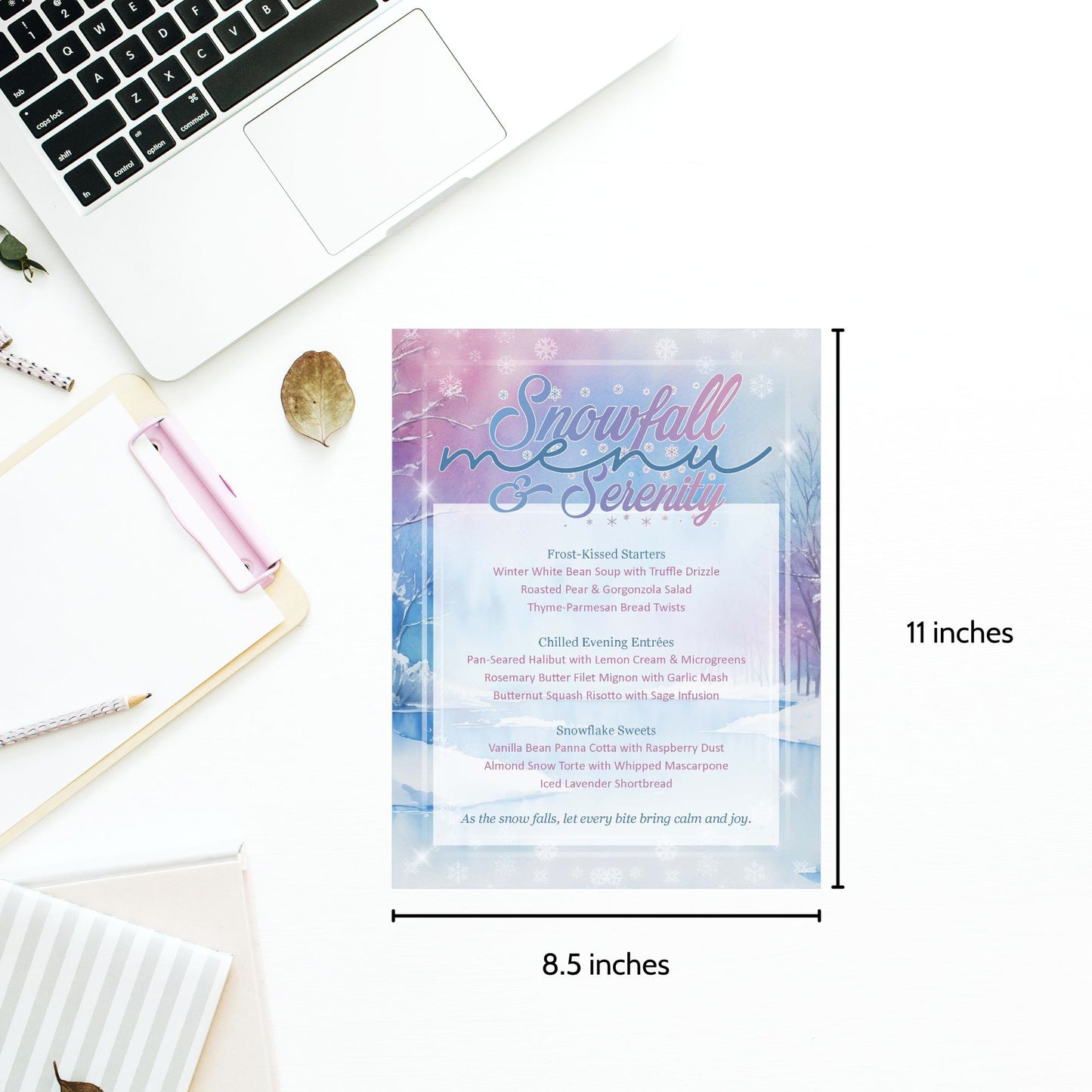 Snowfall menu card with dimensions on a desk with laptop and stationery.