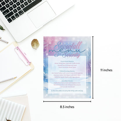 Snowfall menu card with dimensions on a desk with laptop and stationery.