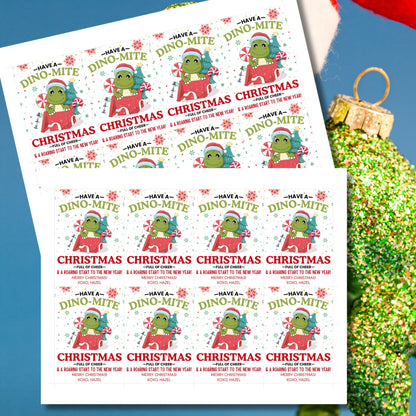 Adorable dinosaur-themed Christmas gift tags featuring a festive green dino in a Santa hat and the message 'Have a Dino-Mite Christmas full of cheer & a roaring start to the New Year!' Perfect for adding a playful touch to holiday gifts.