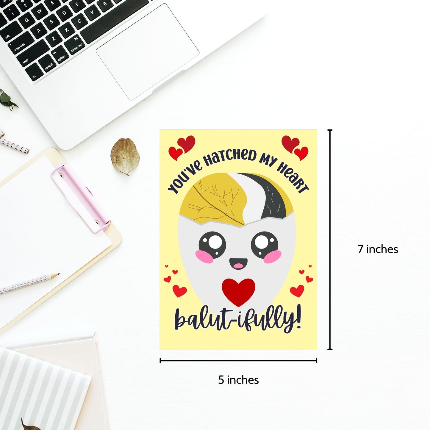 Printable Valentine’s Day card featuring the phrase “You’ve Hatched My Heart Balutifully” with a fun and unique balut (Filipino delicacy) design. Designed as a 5x7 PDF on an 8.5 x 11 sheet with two cards per page. A punny and heartfelt Valentine’s card for Filipino food lovers.