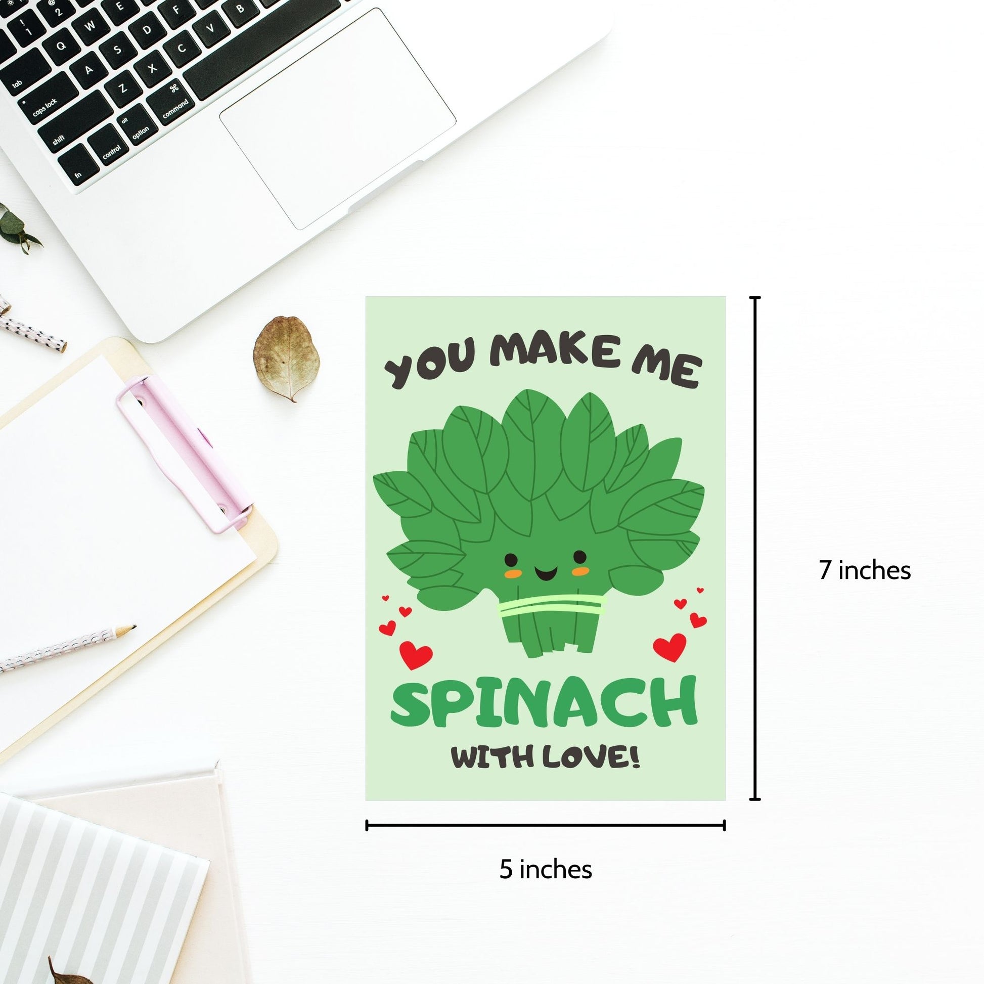 Printable Valentine’s Day Greeting Card featuring the phrase “You Make Me Spinach with Love” with a fun spinach design. Designed as a 5x7 PDF on an 8.5 x 11 sheet with two cards per page. A punny and fresh Valentine’s card for loved ones.