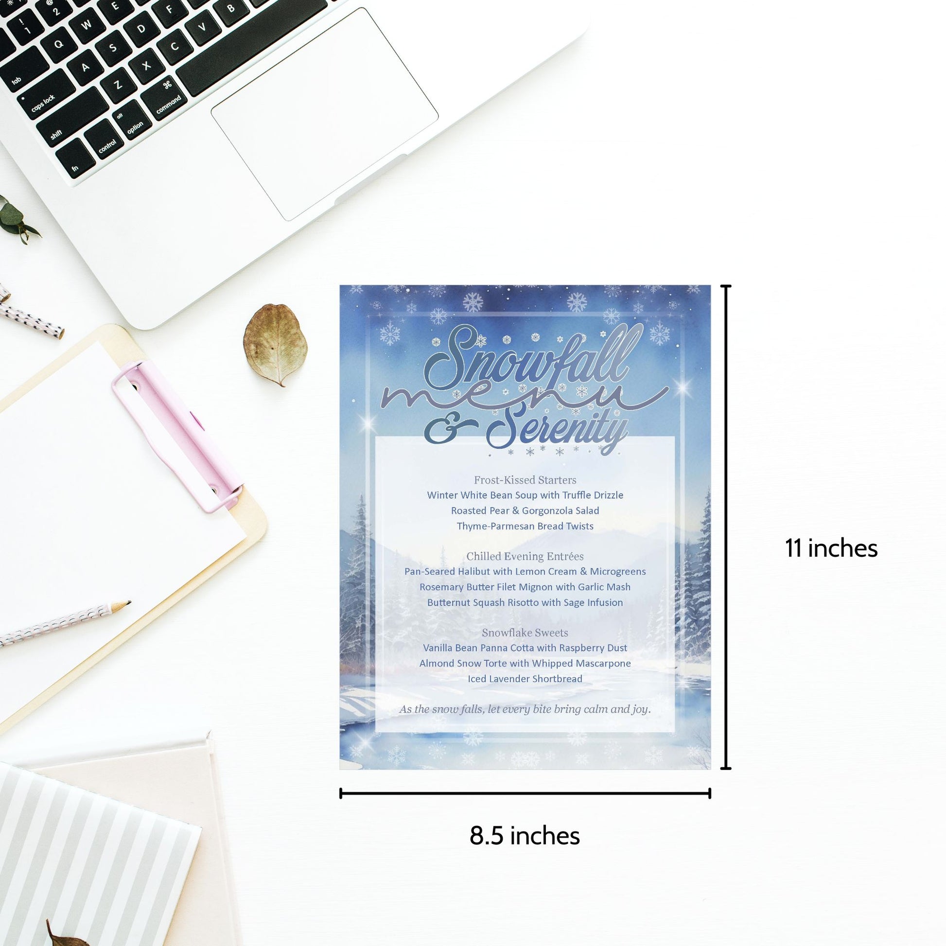Menu with 'Snowfall & Serenity' design on a desk with laptop and stationery items.