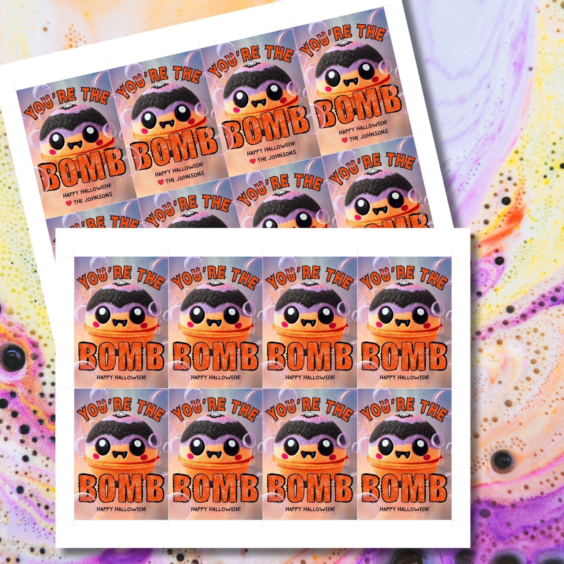 Halloween-themed printable gift tags with the message "You're the Bomb" featuring a cute and spooky bath bomb character, perfect for bath bomb gifts. Tags are 2.5 x 3.5 inches, laid out 8 per sheet on a standard 8.5 x 11-inch page. Includes a printable PDF and a PDF with a link to an editable Canva template.