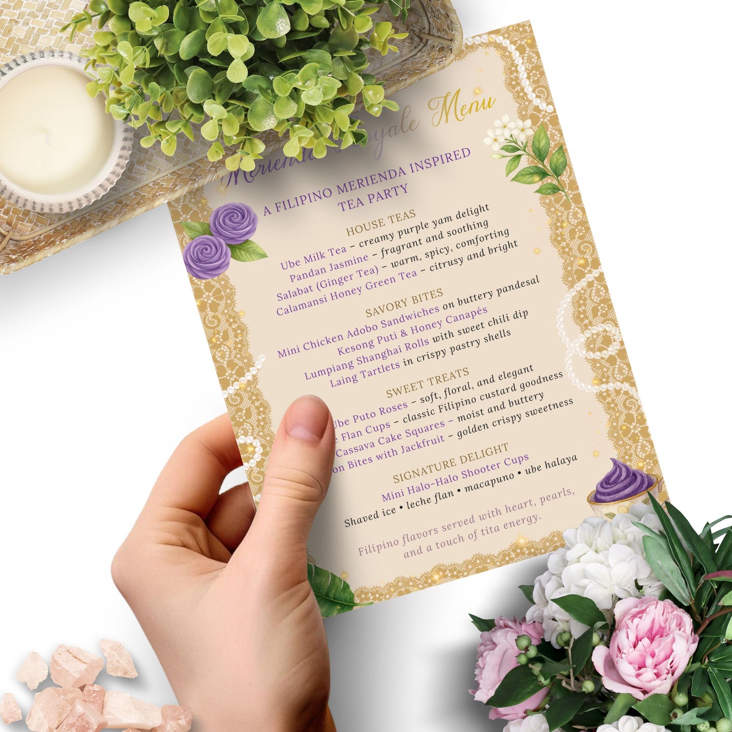 Hand holding a menu card with floral decorations on a white background