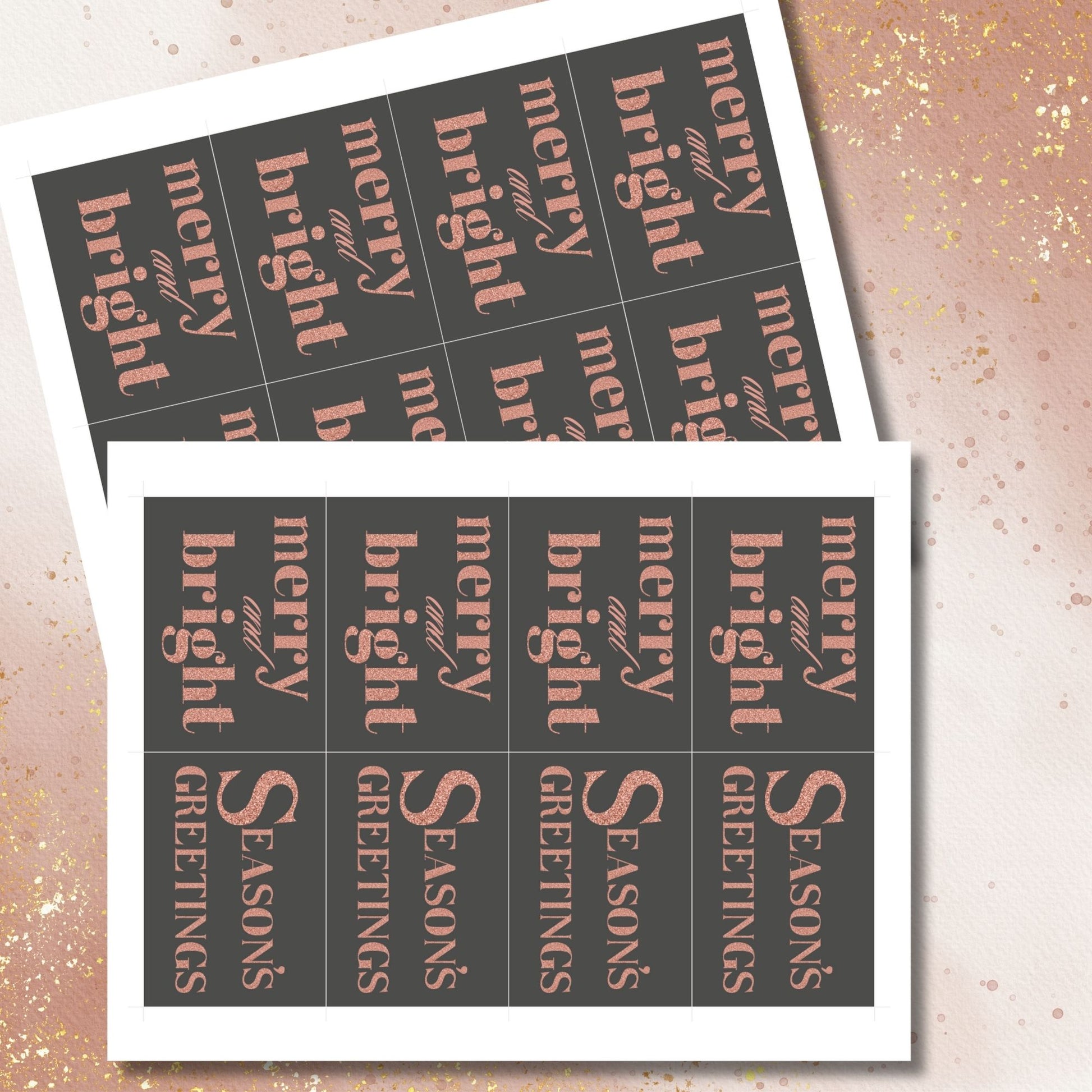 A set of ready-to-print Christmas gift tags featuring a luxurious rose gold glitter text on a bold charcoal background with festive messages like "Merry and Bright" and "Season's Greetings." Each tag measures 2.5 x 3.5 inches.