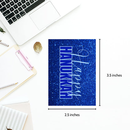 A set of printable Hanukkah gift tags featuring "Happy Hanukkah" in white and blue text on a sparkling blue glitter background. Perfect for Hanukkah gift wrapping.