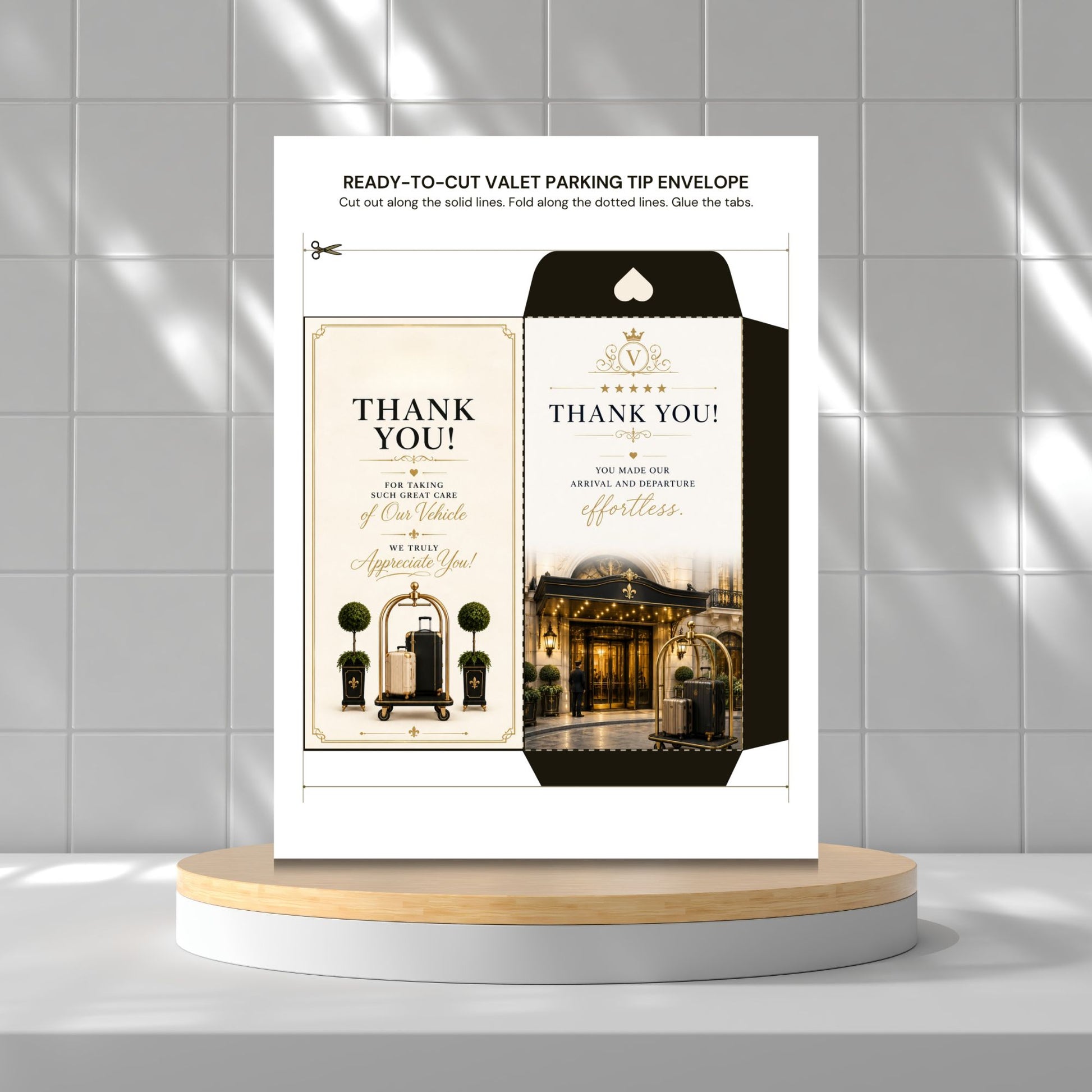 A printed ready-to-cut valet parking tip envelope card set on a white stand, shown against a light gray tiled wall with a wooden platform below. The product includes a thank-you card design with elegant typography and decorative building imagery.