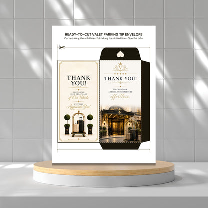 A printed ready-to-cut valet parking tip envelope card set on a white stand, shown against a light gray tiled wall with a wooden platform below. The product includes a thank-you card design with elegant typography and decorative building imagery.