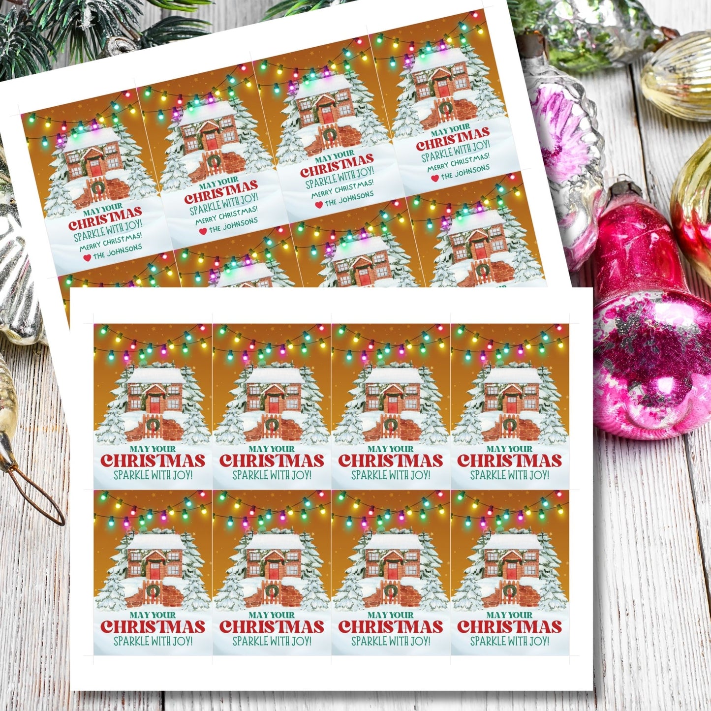 Christmas gift tags featuring a cozy snow-covered house decorated with festive lights, paired with the message "May Your Christmas Sparkle with Joy!" These printable and editable tags add a warm and festive touch to holiday gifts.