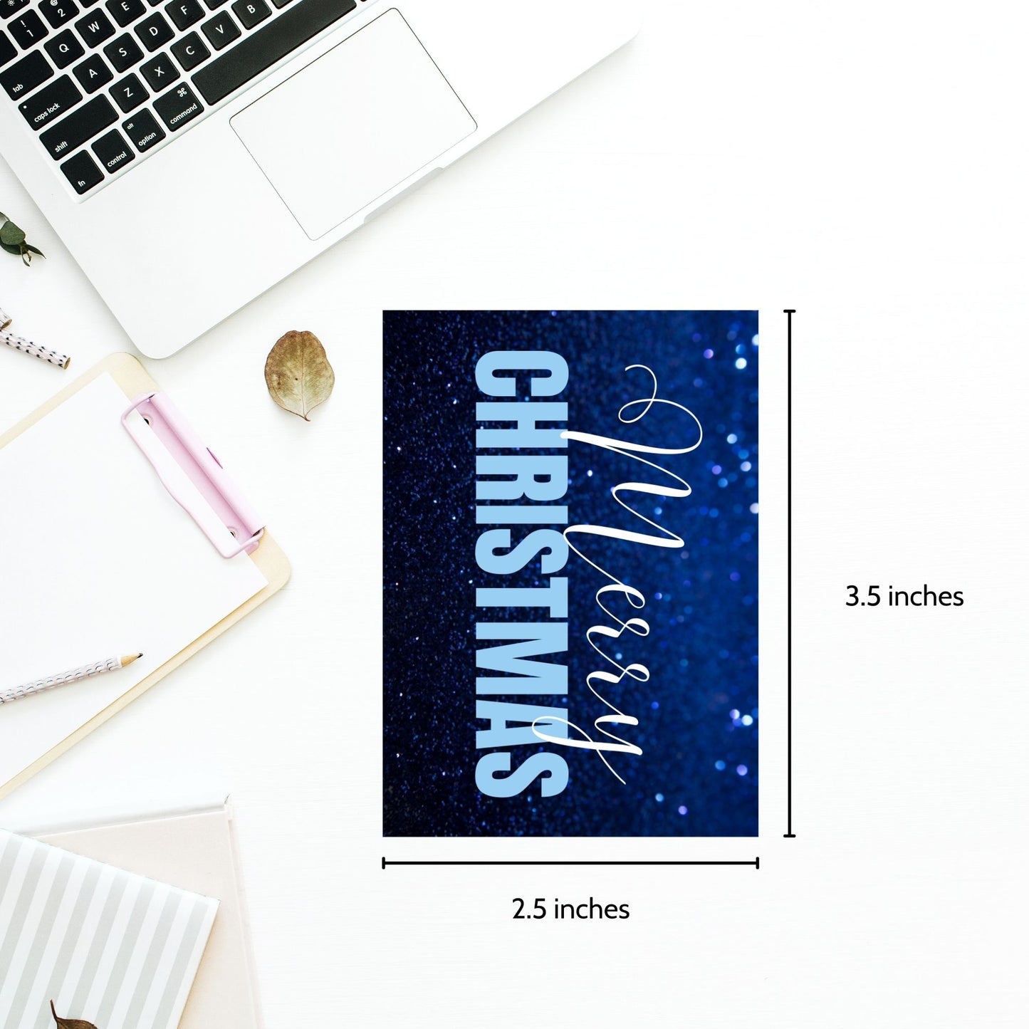 Printable blue Christmas gift tags with a glittery blue background and bold light blue "Merry Christmas" text, sized 2.5 x 3.5 inches, 8 tags per sheet.