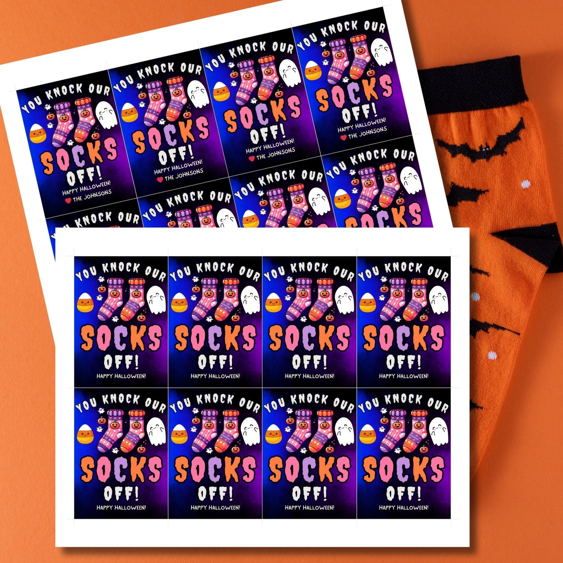 Halloween-themed printable gift tags with the message "You Knock Our Socks Off!" featuring colorful Halloween socks, ghosts, and candy corn. Tags are 2.5 x 3.5 inches, laid out 8 per sheet on a standard 8.5 x 11-inch page. Includes a printable PDF and a PDF with a link to an editable Canva template.