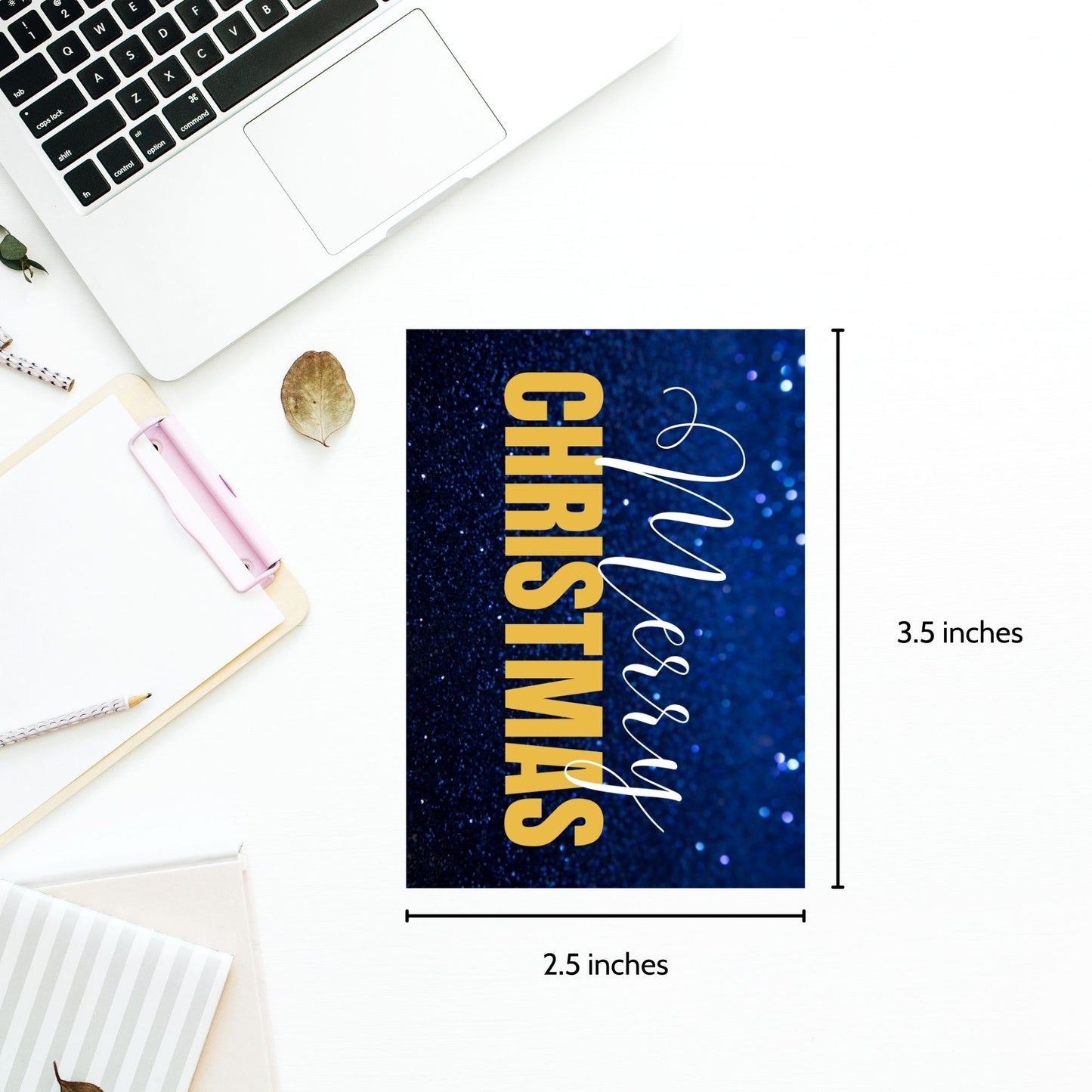 Printable blue and gold Christmas gift tags featuring a sparkling blue glitter background and bold gold "Merry Christmas" text, sized 2.5 x 3.5 inches, 8 per sheet.