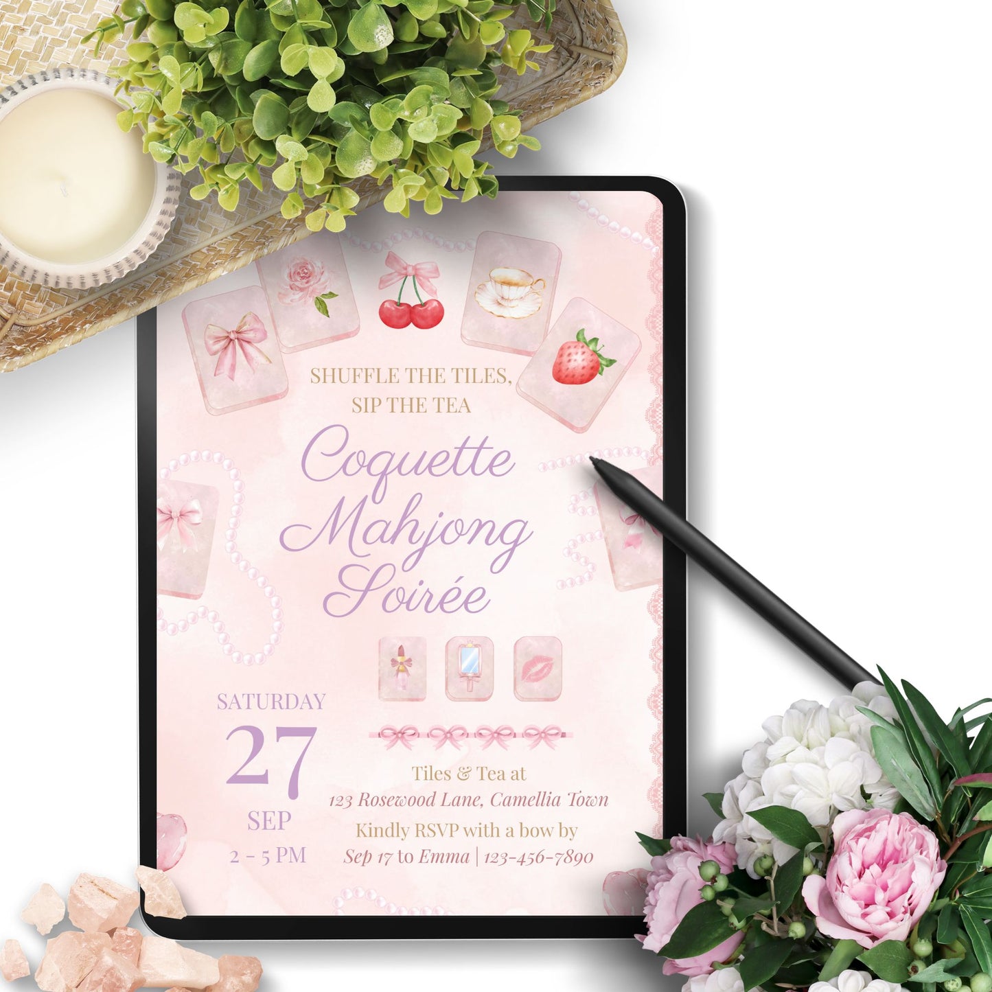 Digital invitation for Coquette Mahjong Soirée displayed on a tablet with flowers and tea.