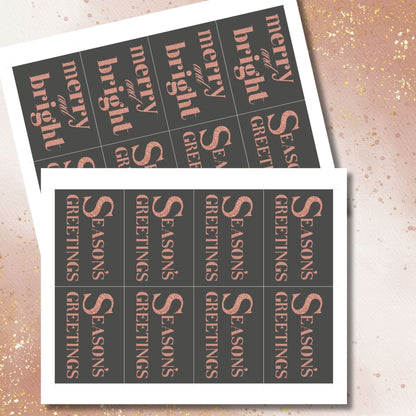 A set of ready-to-print Christmas gift tags featuring a luxurious rose gold glitter text on a bold charcoal background with festive messages like "Merry and Bright" and "Season's Greetings." Each tag measures 2.5 x 3.5 inches.