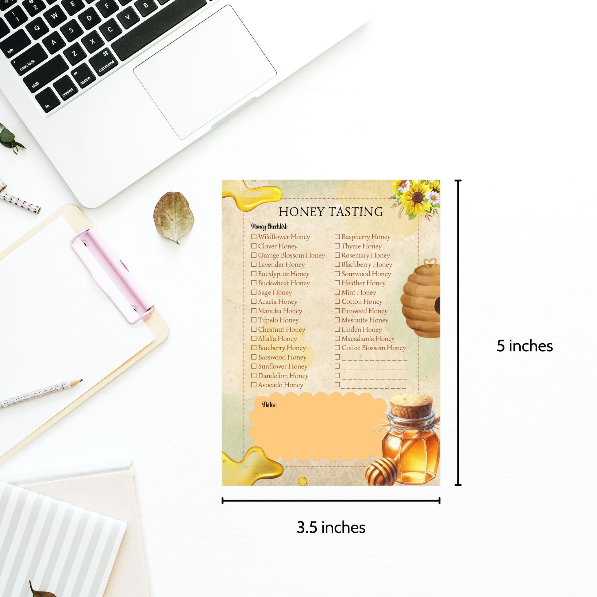 Honey tasting chart with honey jar illustration on a desk with laptop and stationery.