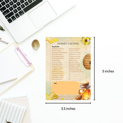 Honey tasting chart with honey jar illustration on a desk with laptop and stationery.
