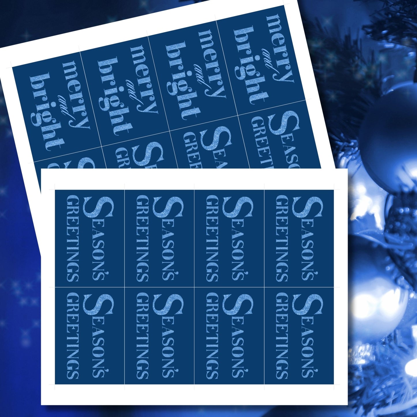 A set of ready-to-print Christmas gift tags featuring glittering icy blue text on a deep navy-blue background with festive messages like "Merry and Bright" and "Season's Greetings." Each tag is 2.5 x 3.5 inches, perfect for adding a frosty, elegant touch to holiday gifting.