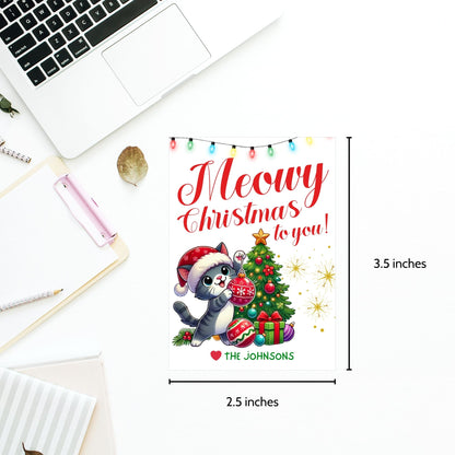 Christmas gift tags featuring a cute kitten in a Santa hat with a festive tree and gifts, paired with the message "Meowy Christmas to you!" These printable and editable tags add a playful, festive touch to holiday gifts for cat lovers.