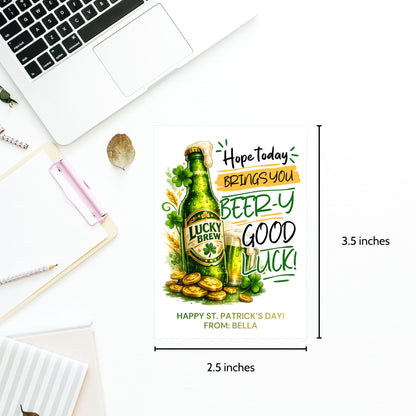 St. Patrick’s Day printable gift tag featuring a green beer-inspired drink with the phrase “Hope Today Brings You Beery Good Luck.” The festive design includes shamrocks and lucky elements. Tags are sized 2.5 x 3.5 inches, arranged 8 per 8.5 x 11 printable sheet, and available as a printable PDF and editable Canva template.