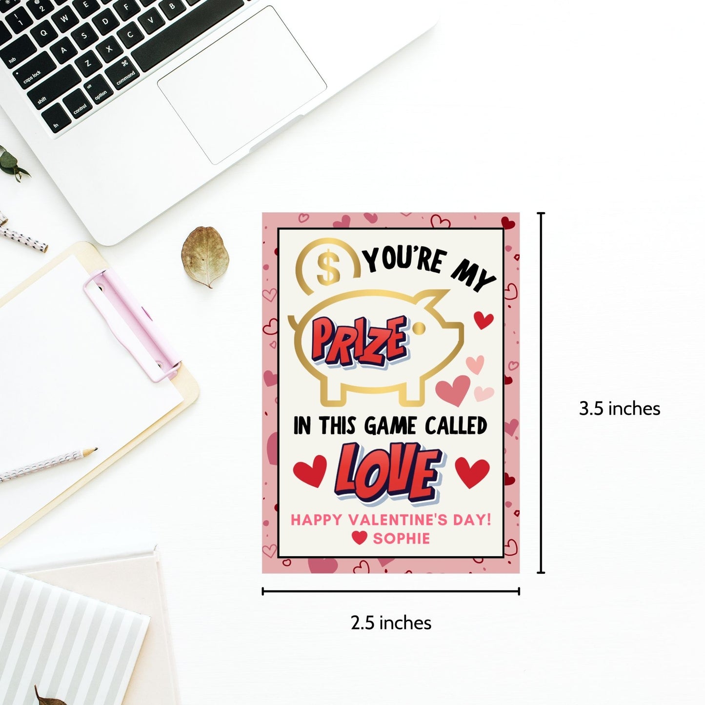 Game-themed Valentine’s Day gift tags featuring a piggy bank design with the message "You’re My Prize in This Game Called Love!" Customizable with a name for personalized gifting.