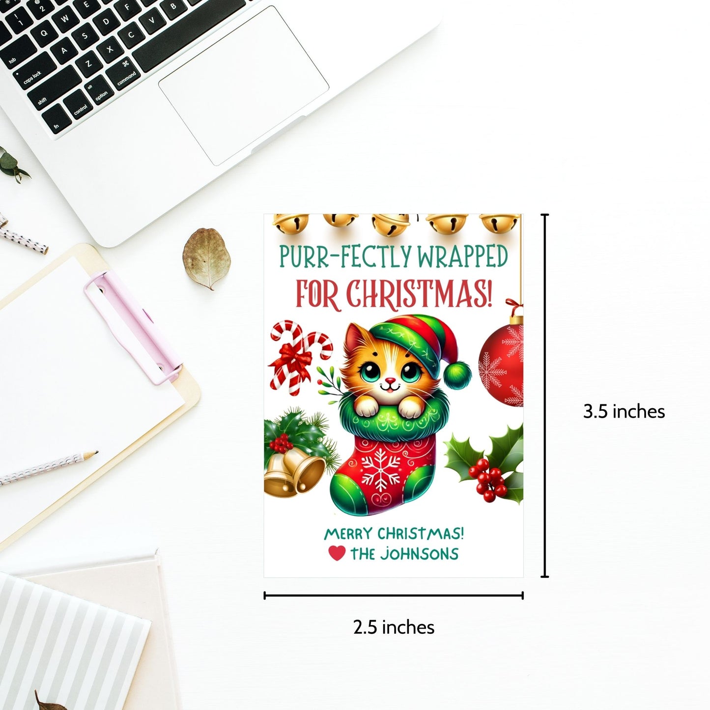 Christmas gift tags featuring a cute kitten snuggled in a festive stocking with holiday decorations like bells, candy canes, and holly, paired with the message "Purr-fectly Wrapped for Christmas!" These printable and editable tags add a cozy, festive touch to holiday gifts.