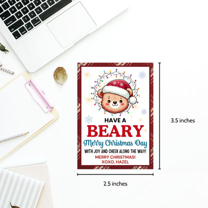 Cute bear-themed holiday gift tags featuring an adorable bear wearing a Santa hat and wrapped in Christmas lights, with the message 'Have a Beary Merry Christmas Day with joy and cheer along the way!' Perfect for personalized holiday gifts.