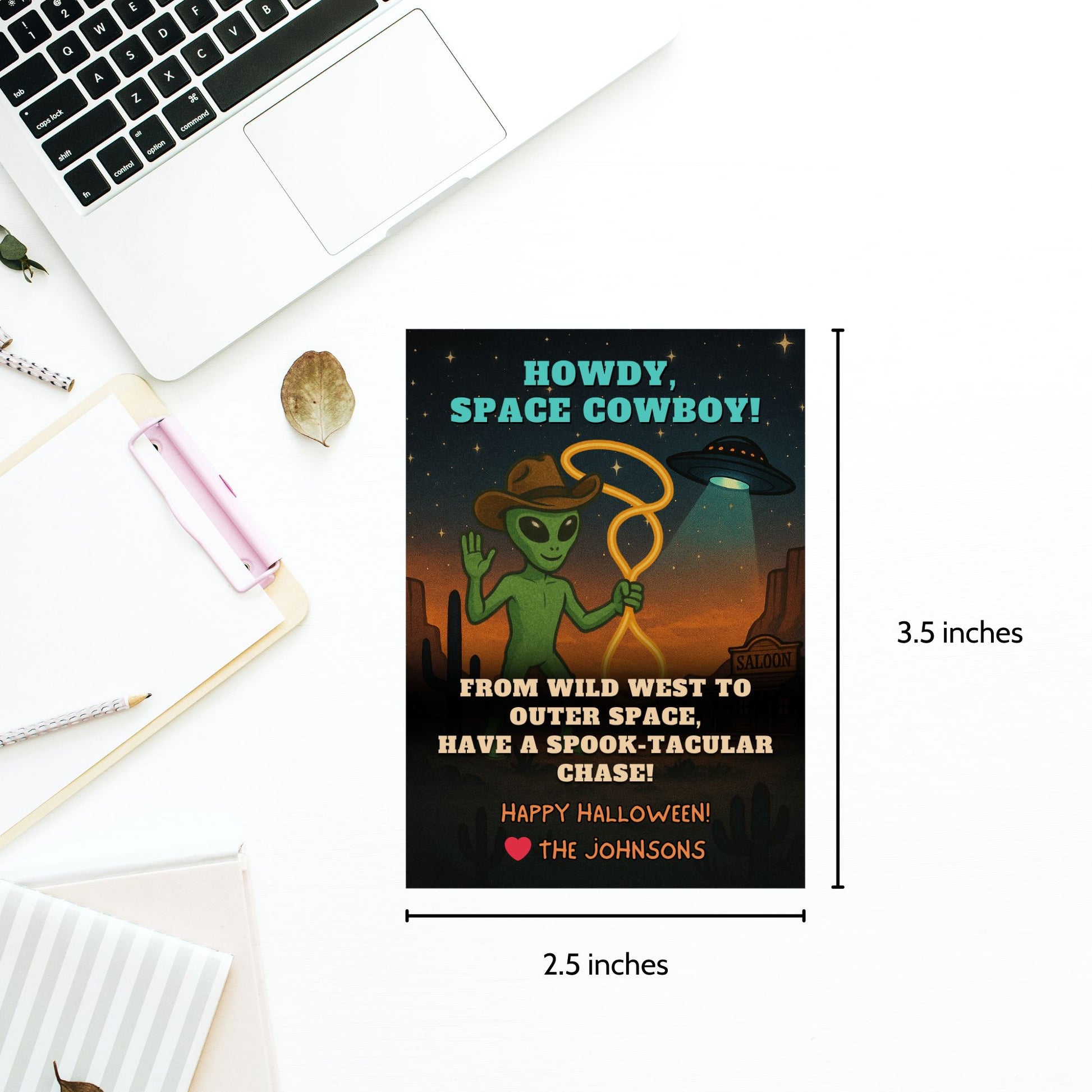 Alien holding a lasso on a Wild West Halloween gift tag with stars and space-themed elements, captioned "Howdy, Space Cowboy!"