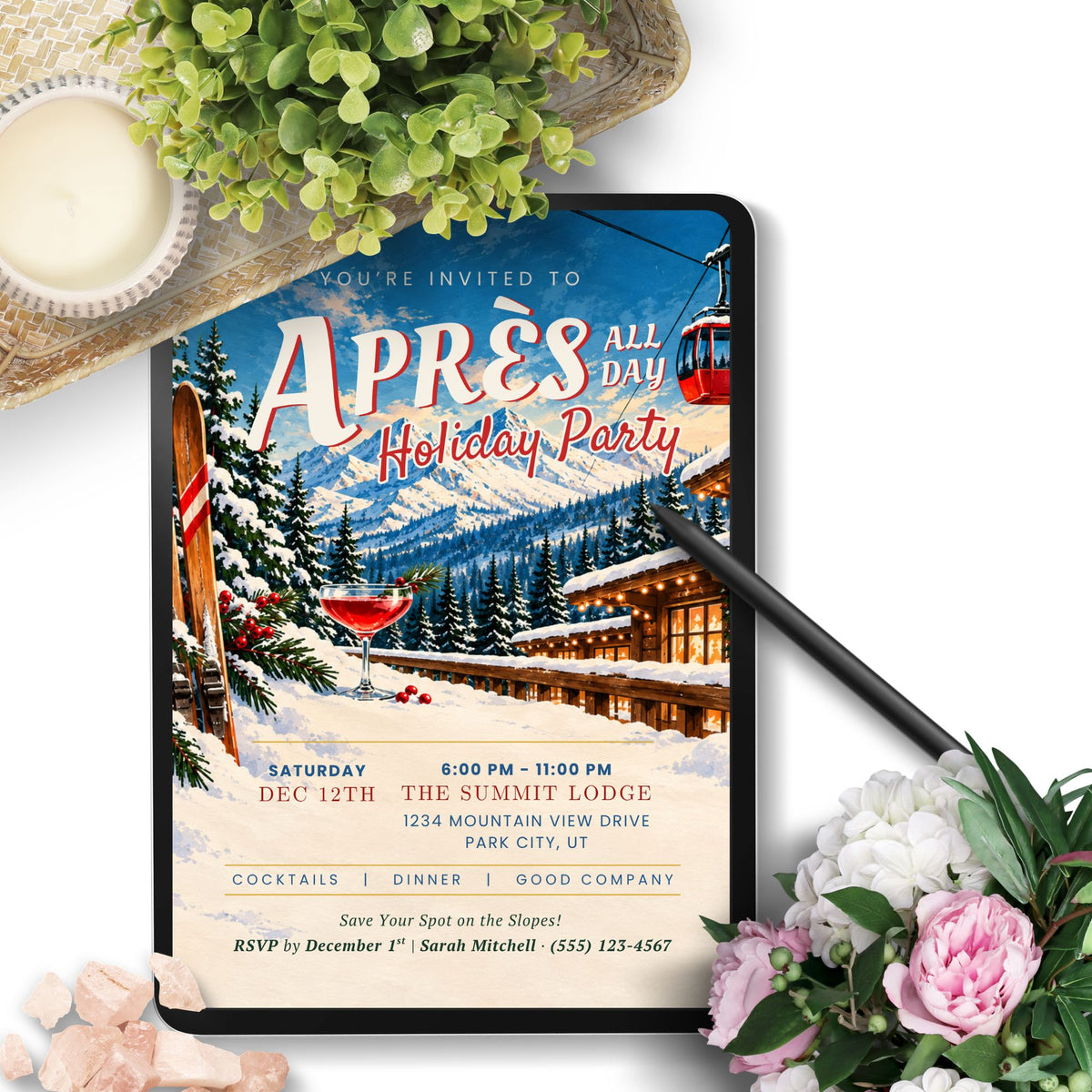 A digital invitation template displayed on a tablet screen, styled in a flat-lay setting with a black stylus, green leaves, a candle, and pink and white flowers on a white background.