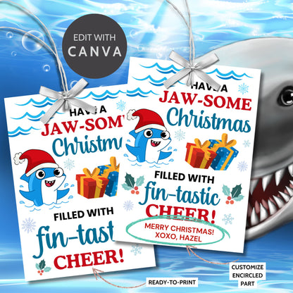 Festive shark-themed holiday gift tags featuring a smiling shark wearing a Santa hat, surrounded by waves, holly, and presents, with the message 'Have a JAW-some Christmas filled with fin-tastic cheer!' Perfect for personalized Christmas gifts.