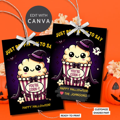 Halloween-themed printable gift tags with the message "Just Poppin' By to Say You're Corn-y in the Best Way" featuring a cute popcorn character dressed in Halloween attire. Tags are 2.5 x 3.5 inches, laid out 8 per sheet on a standard 8.5 x 11-inch page. Includes a printable PDF and a PDF with a link to an editable Canva template.
