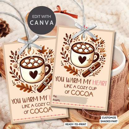 Editable hot cocoa-themed fall gift tags with the message 'You Warm My Heart Like a Cozy Cup of Cocoa' in 2.5 x 3.5 inches, 8 per sheet, available as printable and customizable PDFs.