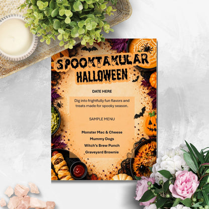A Halloween-themed menu card styled in a flat-lay arrangement with a candle, greenery, and flowers on a light gray textured surface. The card features a spooky orange and black design with the text 'SPOONULAR HALLOWEEN' and sample menu items.