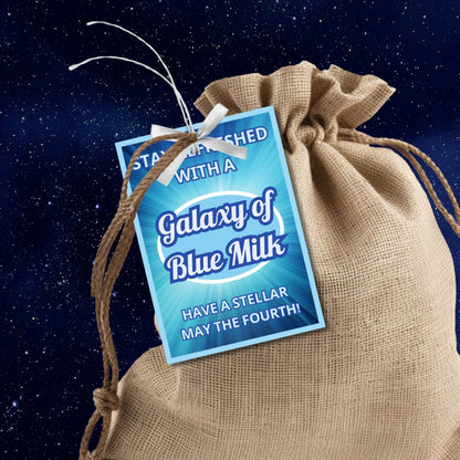 Star Wars-themed gift tags for May the Fourth with blue swirling design background and white text Stay Refreshed with a Galaxy of Blue Milk for a stellar celebration.