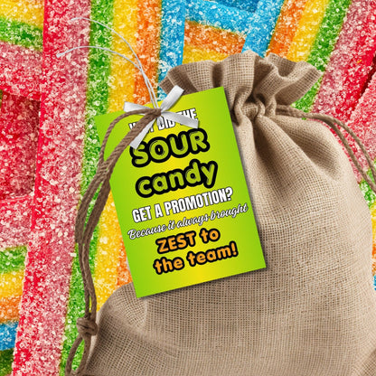 Why Did the Sour Candy Get a Promotion? Fathers Day gift tags with a bright green design. Features a joke about sour candy bringing zest to the team, with a customizable name field. Available as a printable PDF and an editable Canva template.