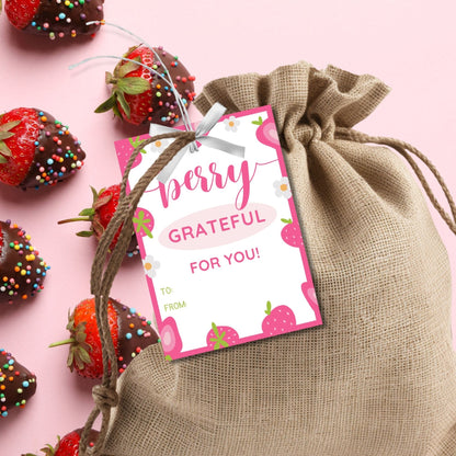 Cheerful pink gift tags adorned with strawberries and the phrase Berry Grateful For You! Berry thankful for all you do! Perfect for adding a heartfelt touch to any gift.