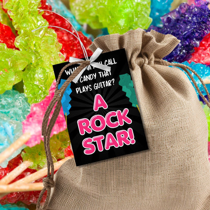 Eight guitar candy-themed Fathers Day gift tags displayed in two rows of four. Each tag features a dad joke about a candy that plays guitar being a rock star, with a customizable name slot.